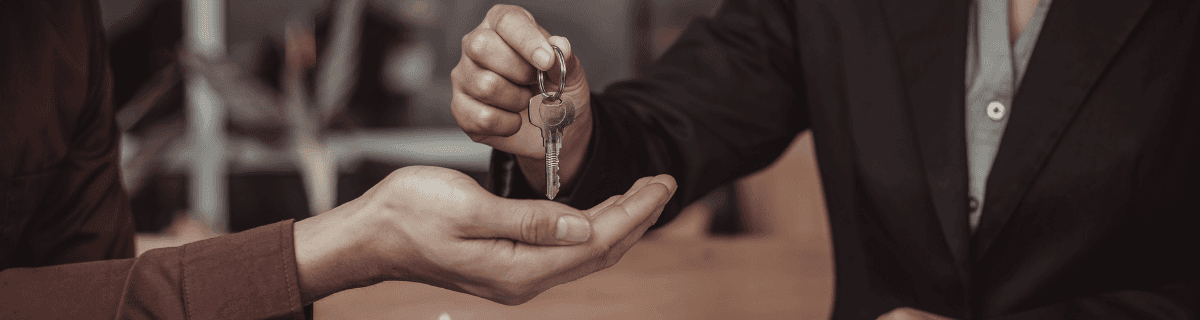 Real estate agent with clients viewing property